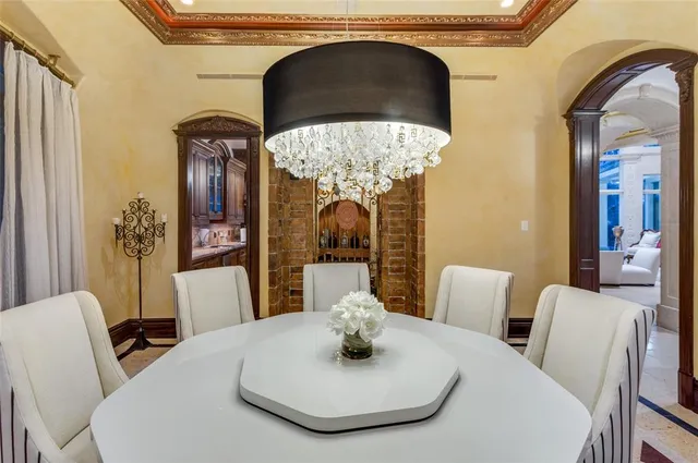 a view of a chairs and table in patio with a backyard
