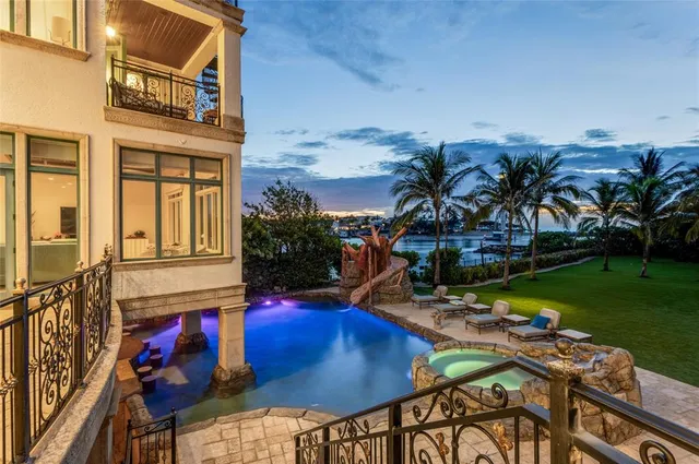 a spacious bathroom with a tub and 2 sink