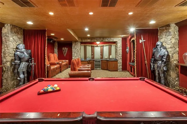 a front view of a house with a garden and trees