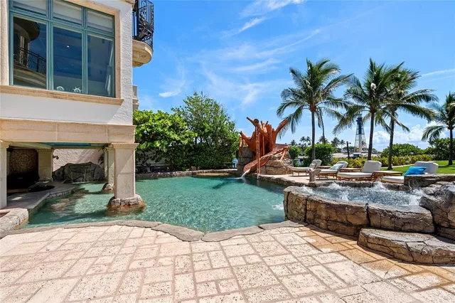 an aerial view of multiple houses with yard