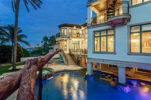 an aerial view of residential houses with outdoor space and street view