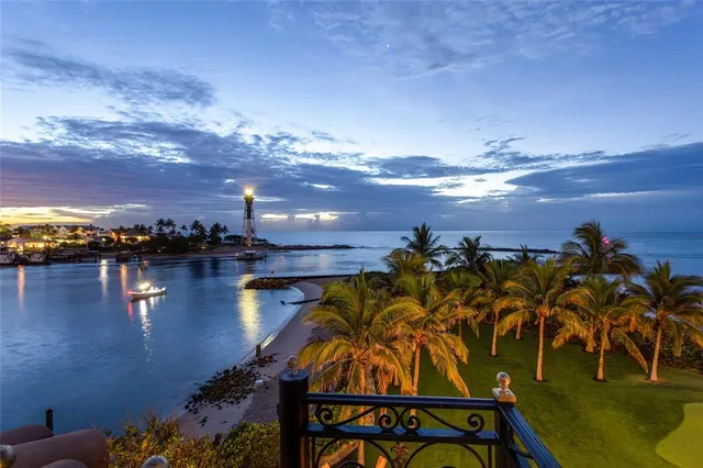 a view of a wooden door with a bathroom