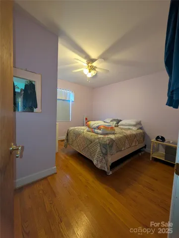 a bedroom with a bed and a tv