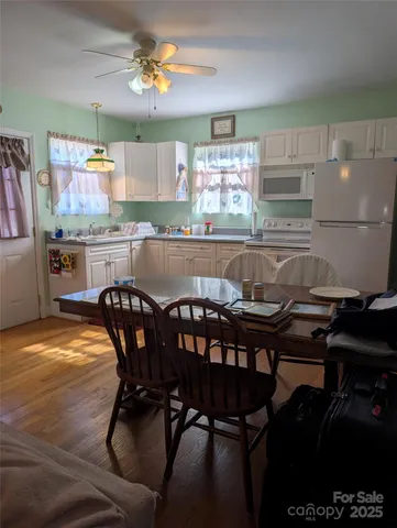 a view of a dining room with furniture and window