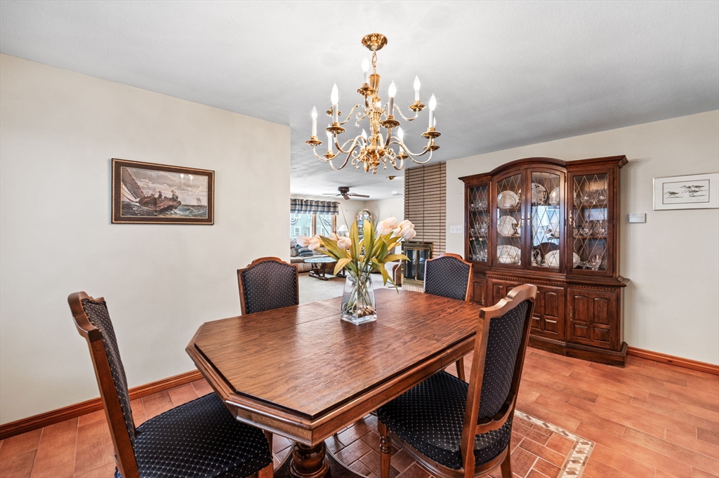 22 Thompson Road Marblehead, MA 01945 - Photo 11 of 41 a view of a dining room with furniture a chandelier and wooden floor