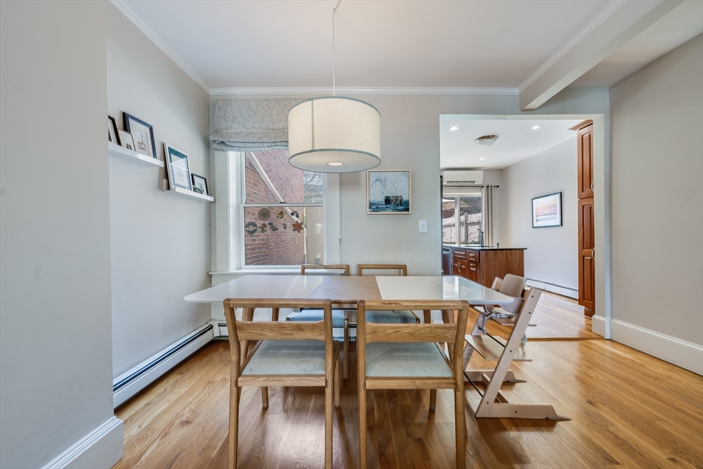 39 Emerson Street Boston, MA 02127 - Photo 5 of 20 a view of a dining room with furniture wooden floor and chandelier