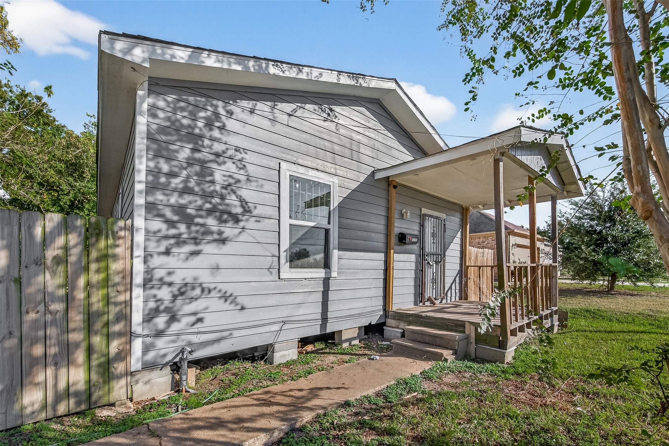 8211 Parnell Street Houston, TX 77051 - Photo 1 of 22 a front view of a house with garden