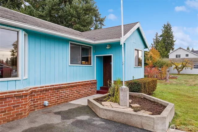 a front view of a house with garden