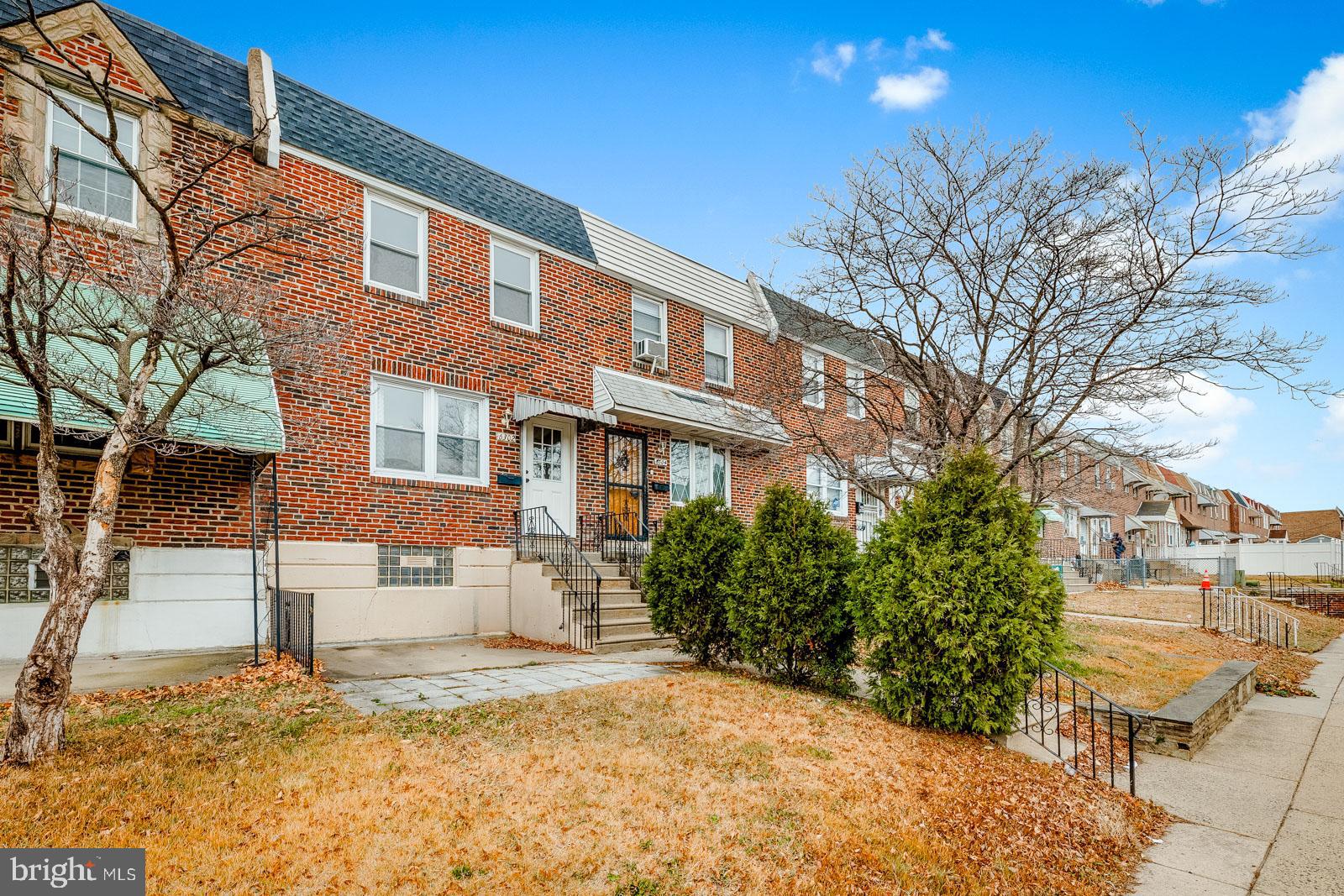 6302 Hegerman Street Philadelphia, PA 19135 - Photo 2 of 26 a front view of a house with a yard