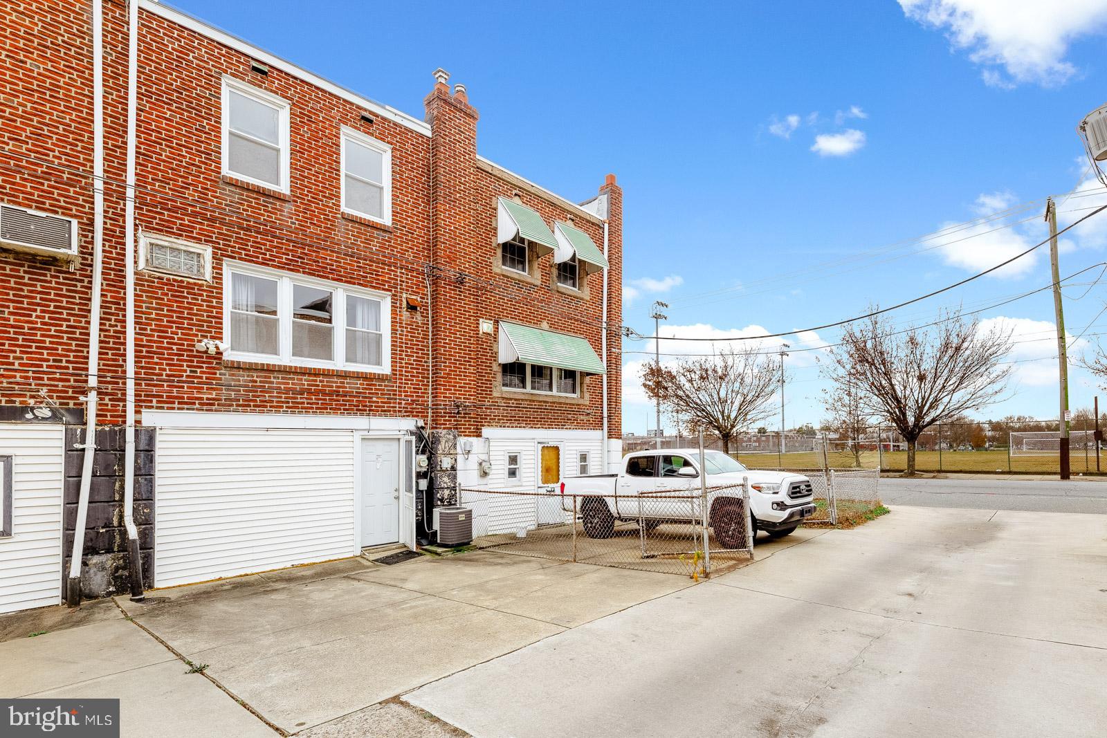 6302 Hegerman Street Philadelphia, PA 19135 - Photo 26 of 26 a view of a building with cars parked on the roadside