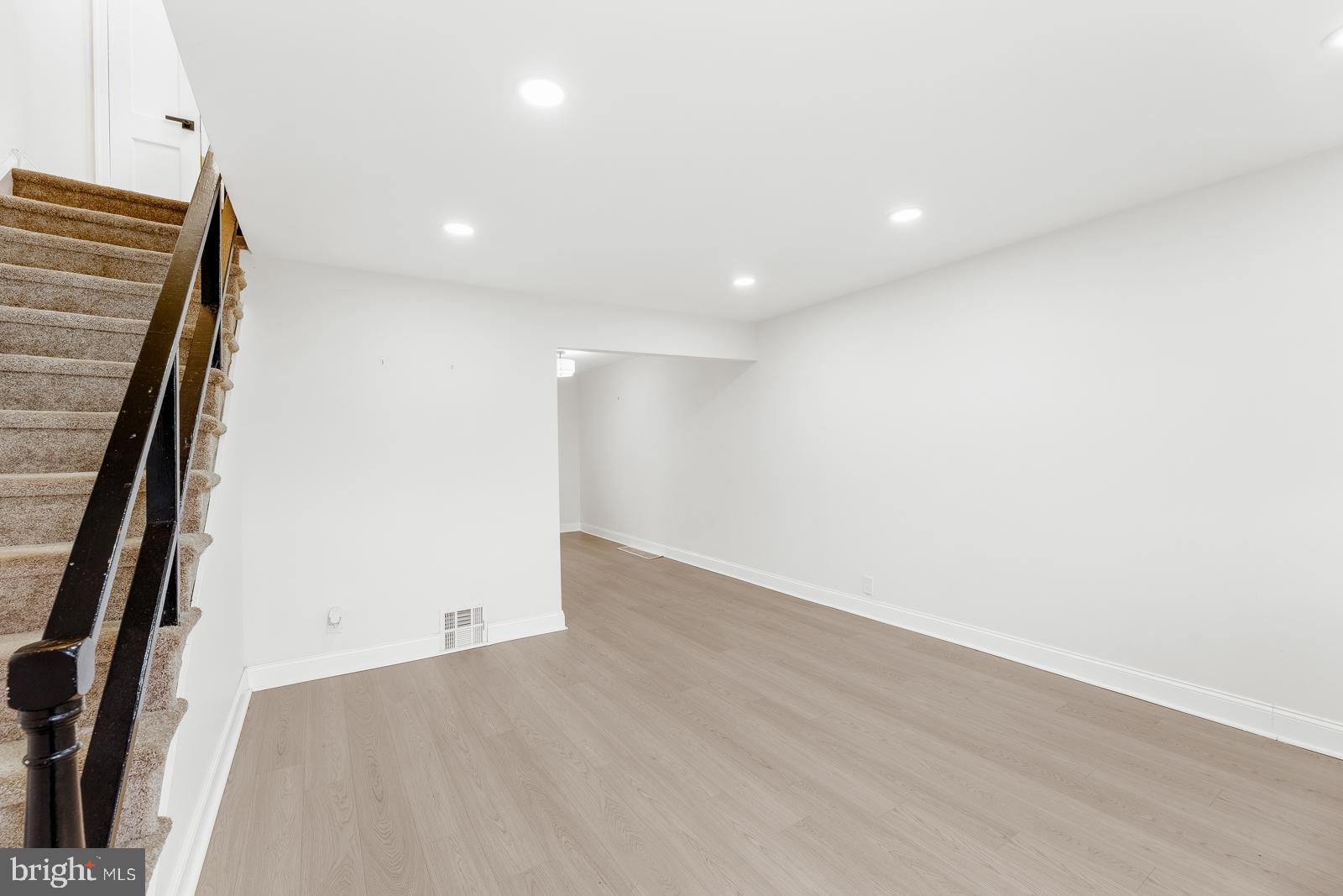 6302 Hegerman Street Philadelphia, PA 19135 - Photo 6 of 26 an empty room with wooden floor and entrance