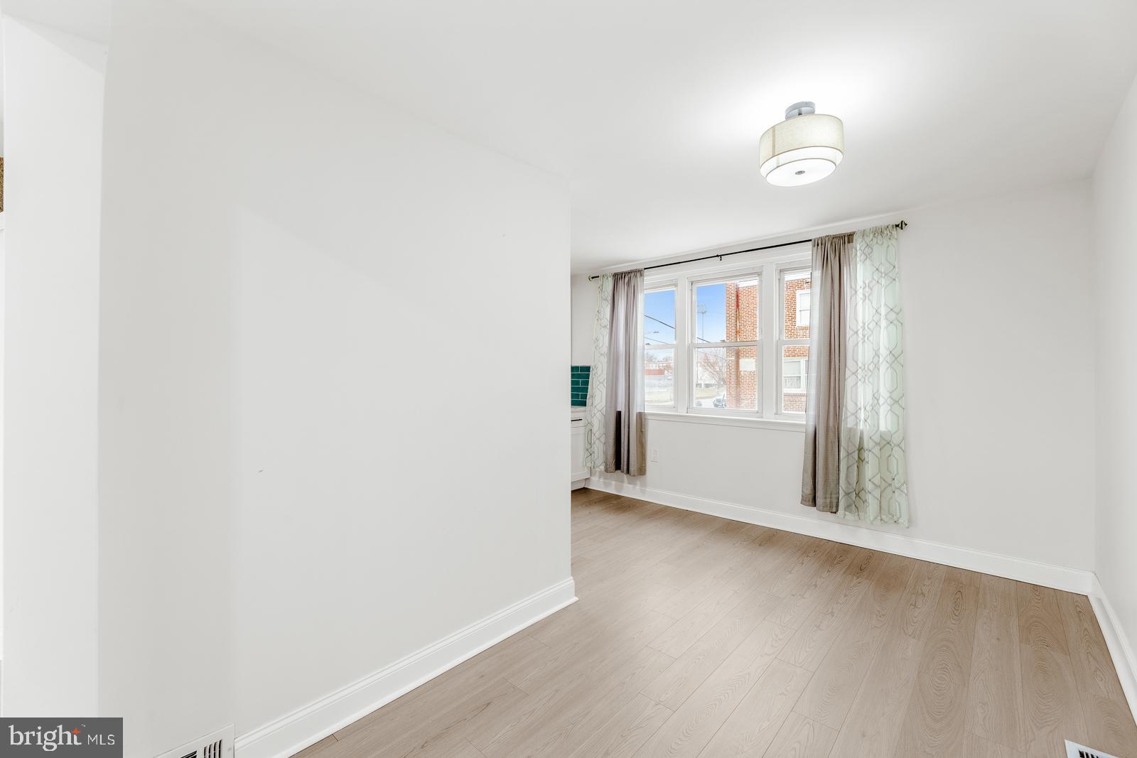 6302 Hegerman Street Philadelphia, PA 19135 - Photo 7 of 26 a view of an empty room with a window
