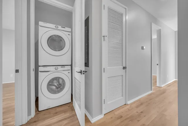 a view of a hallway with washer and dryer