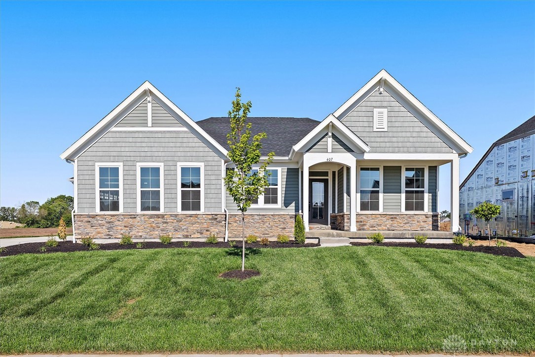 407 South Landon Lane Springfield, OH 45502 - Photo 1 of 30 A newly constructed residence showcasing classic architectural lines and a well-manicured lawn.