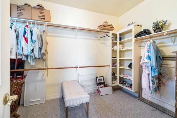 a bedroom with a bed window and a table