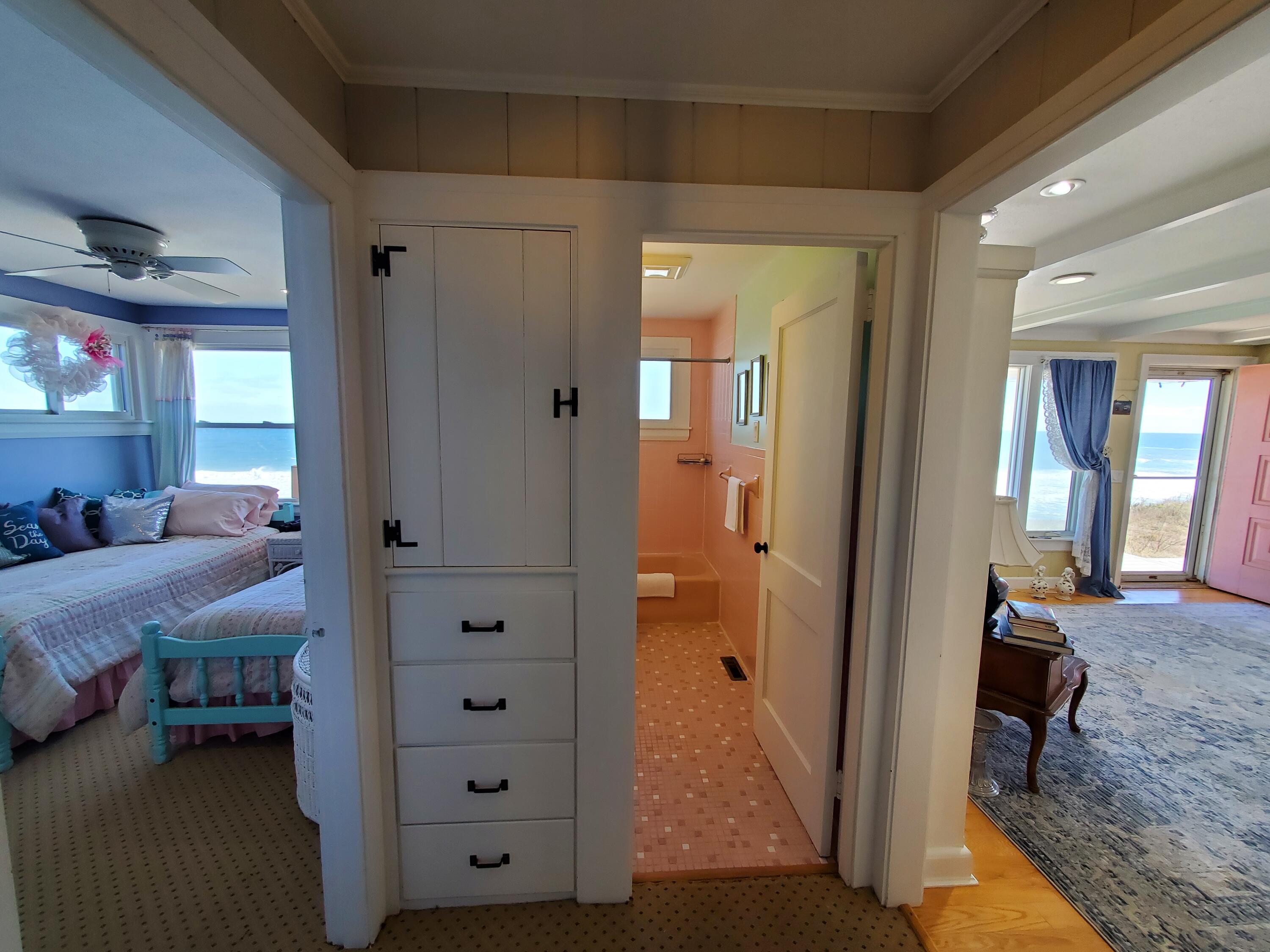 157 Brownell Road Eastham, MA 02642 - Photo 18 of 34 a view of a bedroom with a bed and hallway