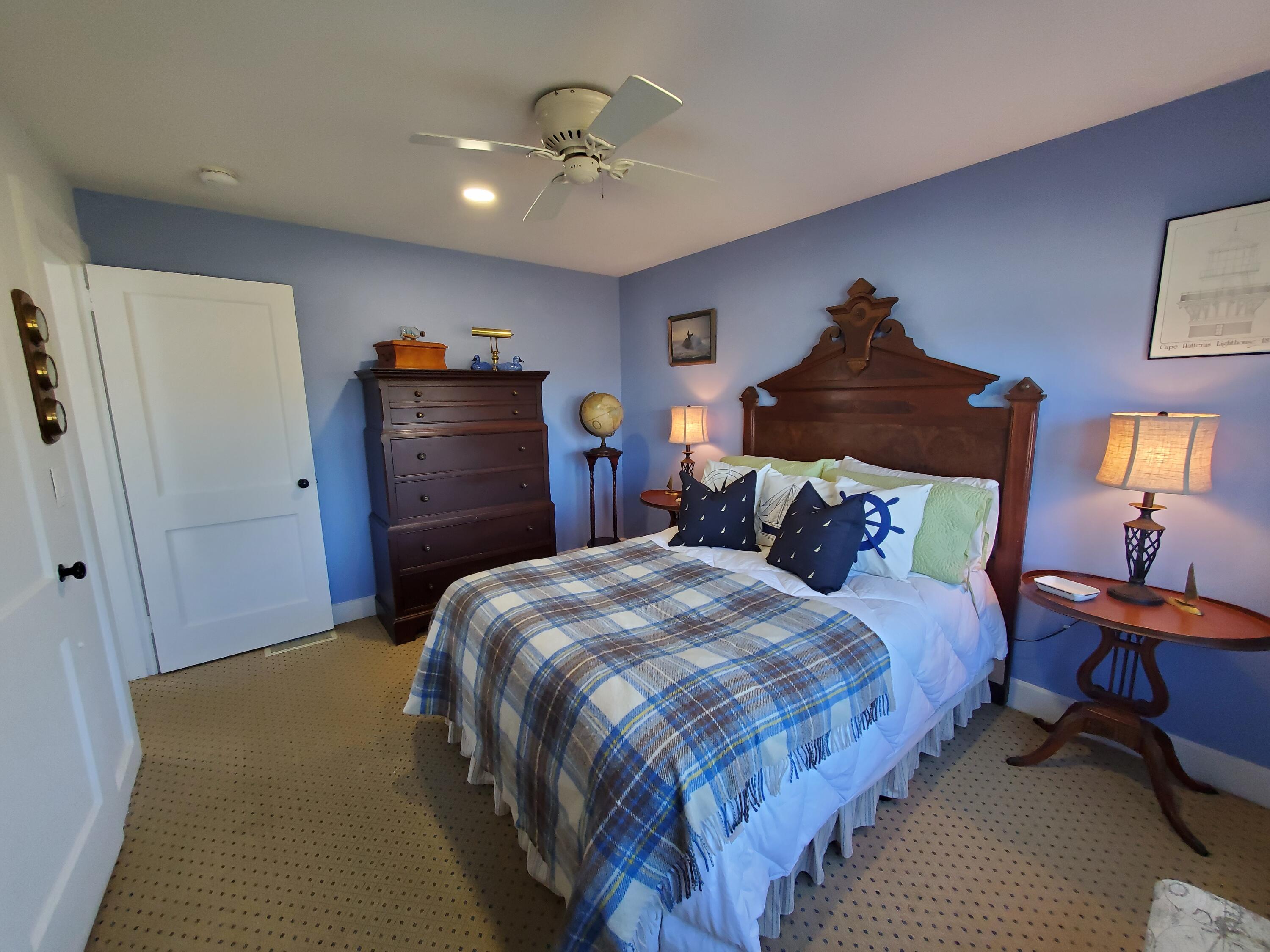 157 Brownell Road Eastham, MA 02642 - Photo 23 of 34 a bedroom with bed and wooden floor