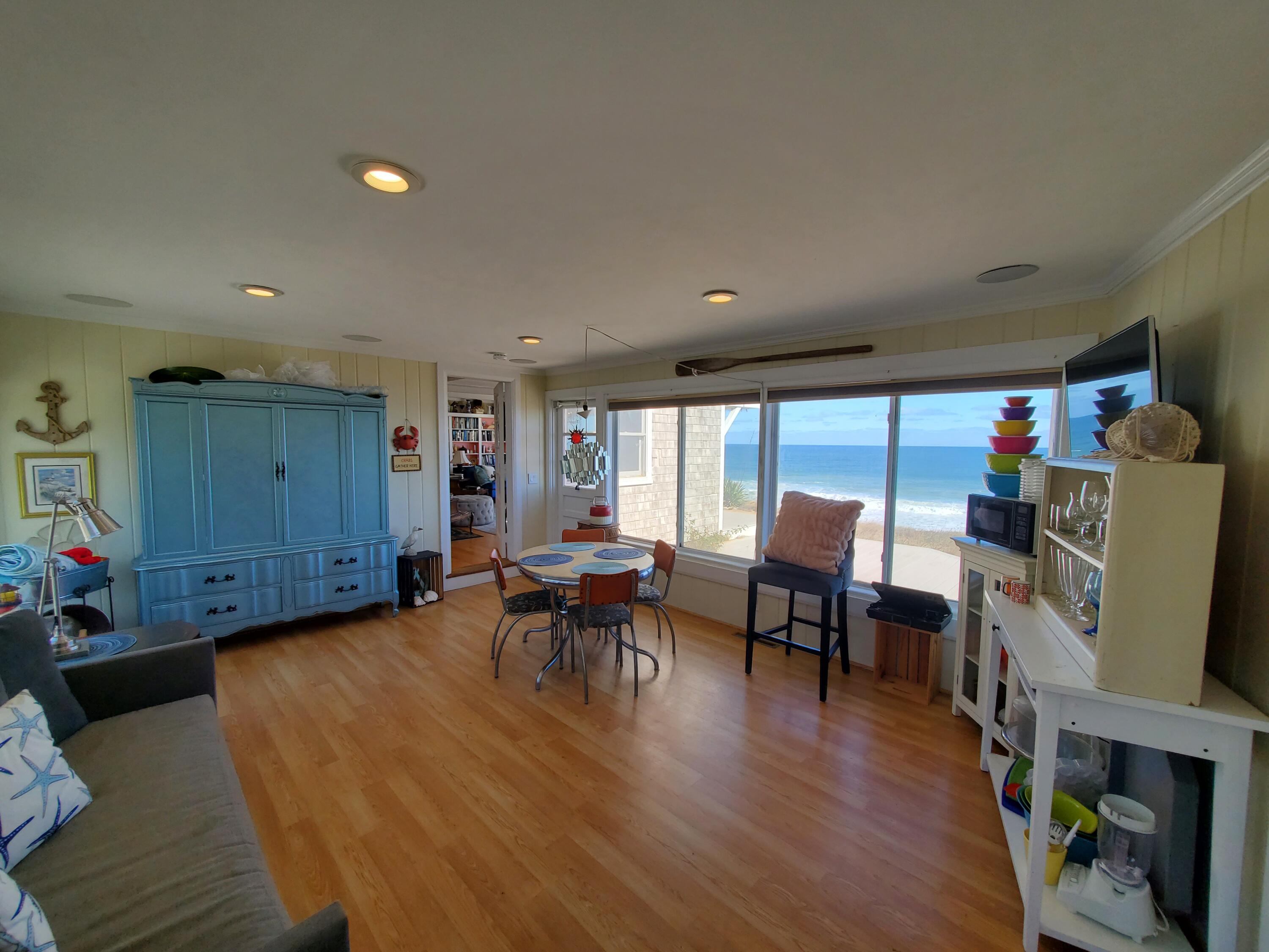 157 Brownell Road Eastham, MA 02642 - Photo 25 of 34 a living room with furniture and a wooden floor