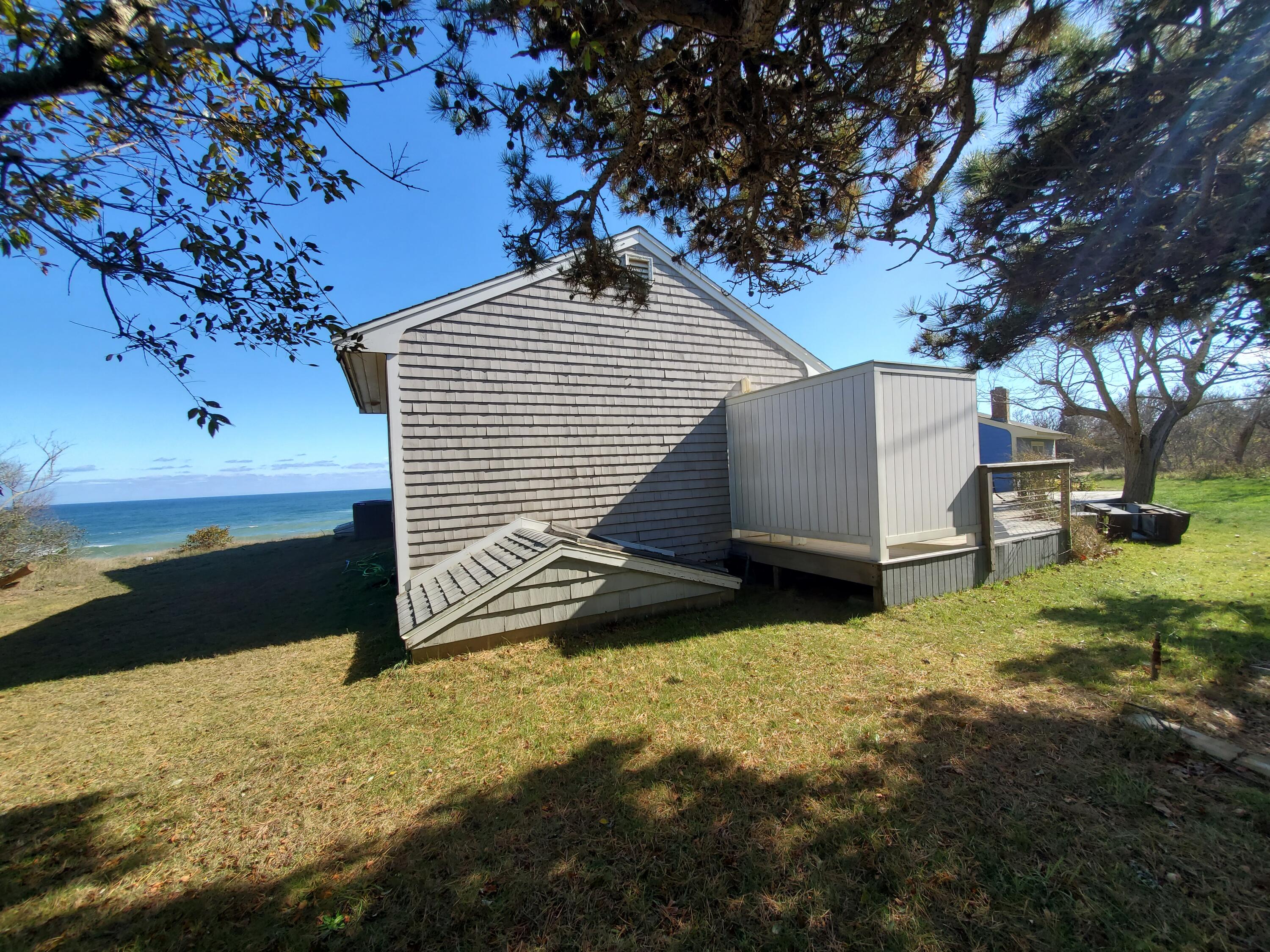 157 Brownell Road Eastham, MA 02642 - Photo 30 of 34 a backyard of a house with lots of green space