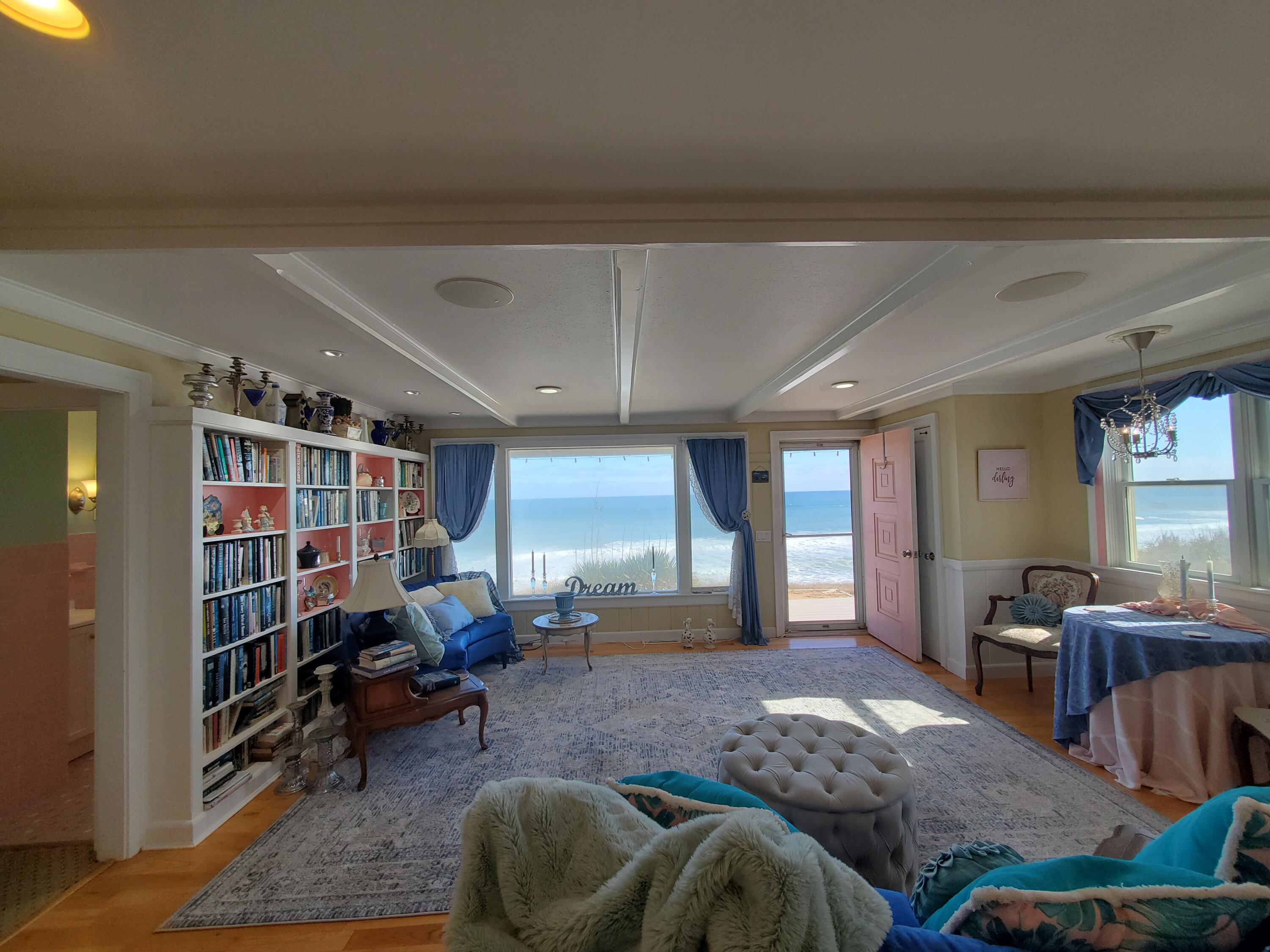 157 Brownell Road Eastham, MA 02642 - Photo 10 of 34 a living room with furniture and a book shelf