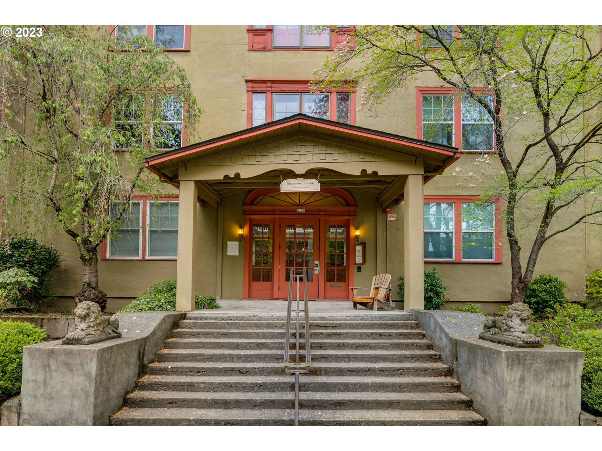 2129 Northwest Northrup Street, Unit 1 Portland, OR 97210 - Photo 2 of 37 a view of a house with entrance stairs and a garden