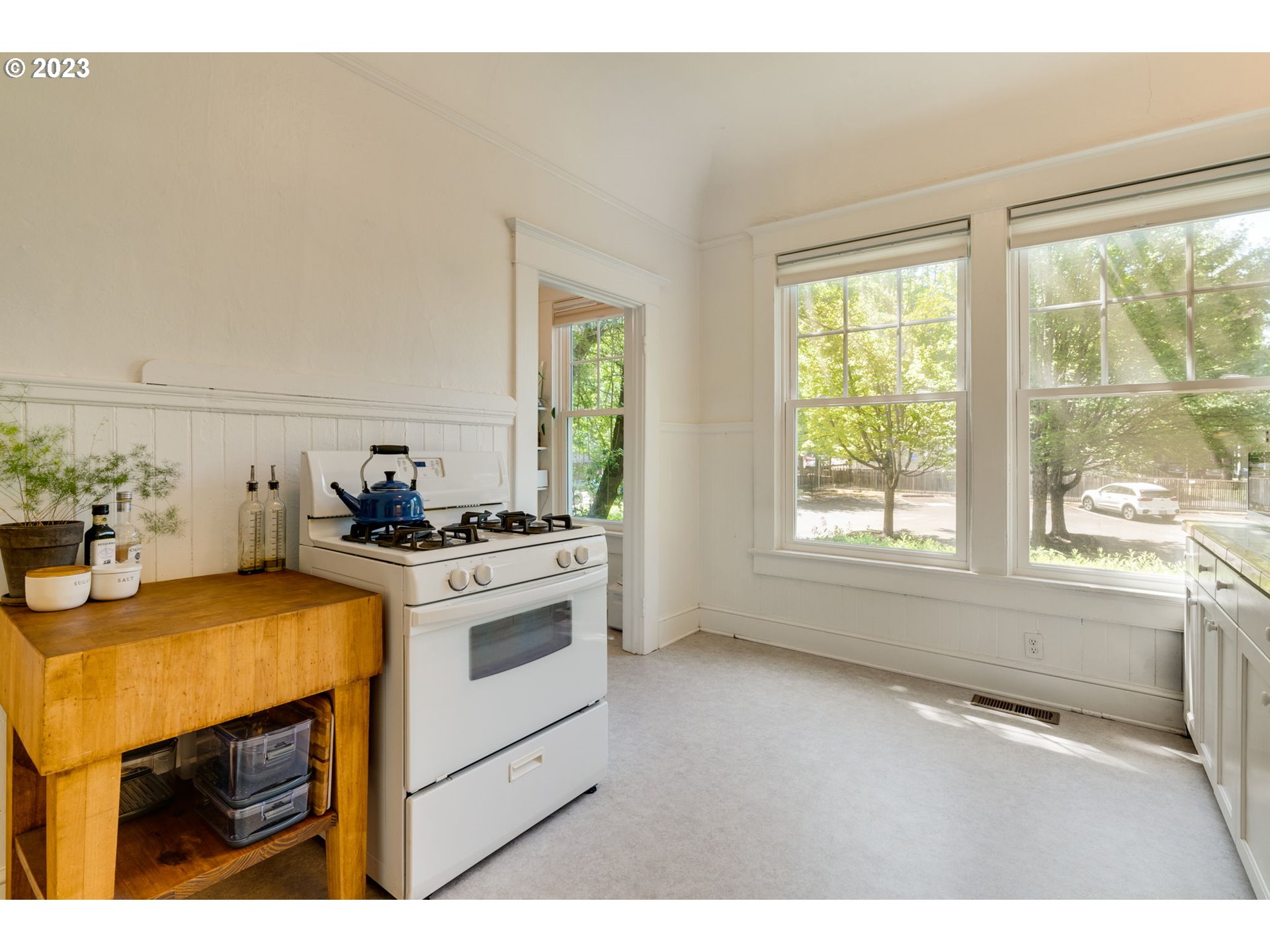 2129 Northwest Northrup Street, Unit 1 Portland, OR 97210 - Photo 25 of 37 a kitchen with a stove and a microwave