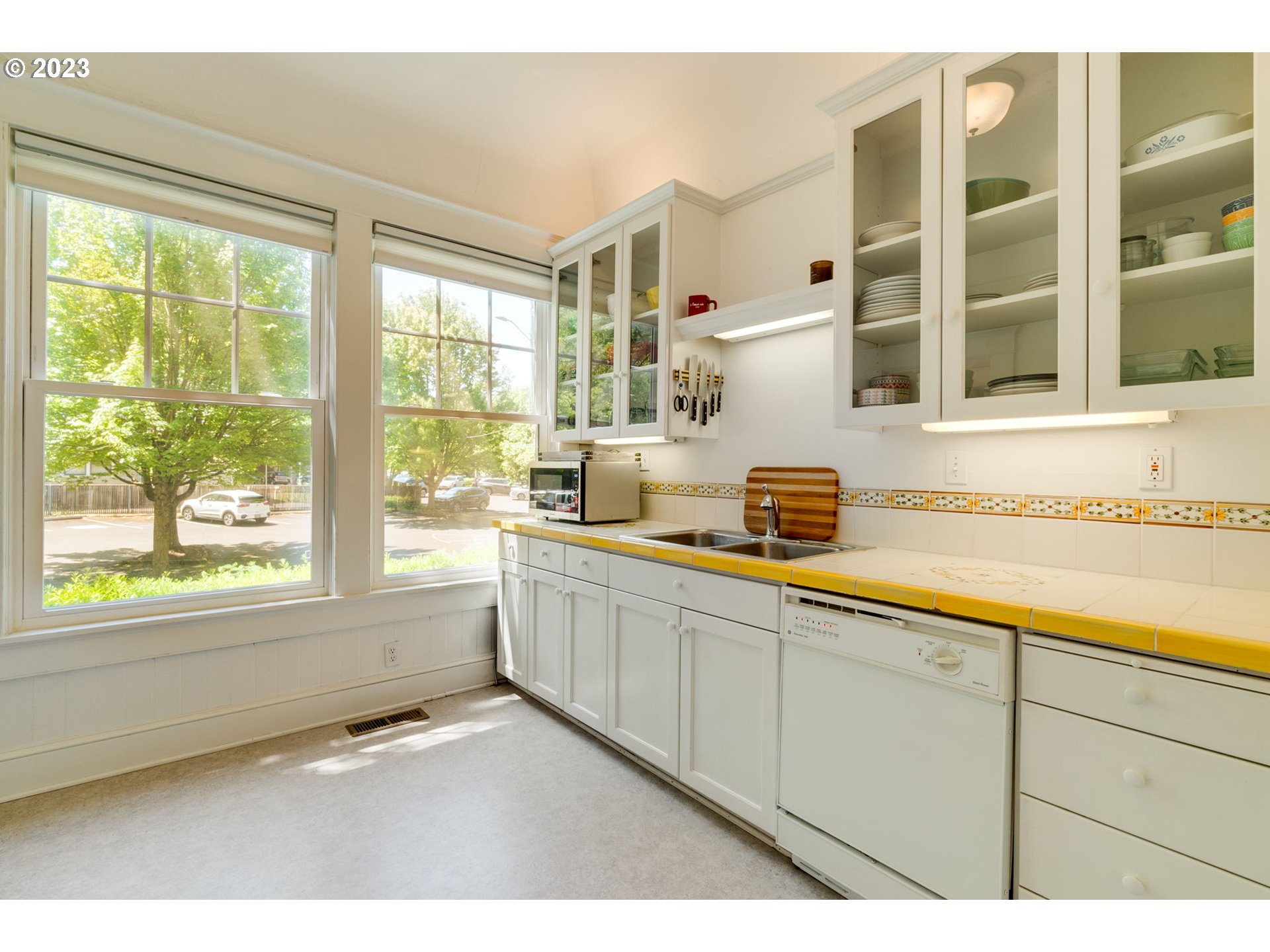 2129 Northwest Northrup Street, Unit 1 Portland, OR 97210 - Photo 26 of 37 a kitchen with cabinets and window
