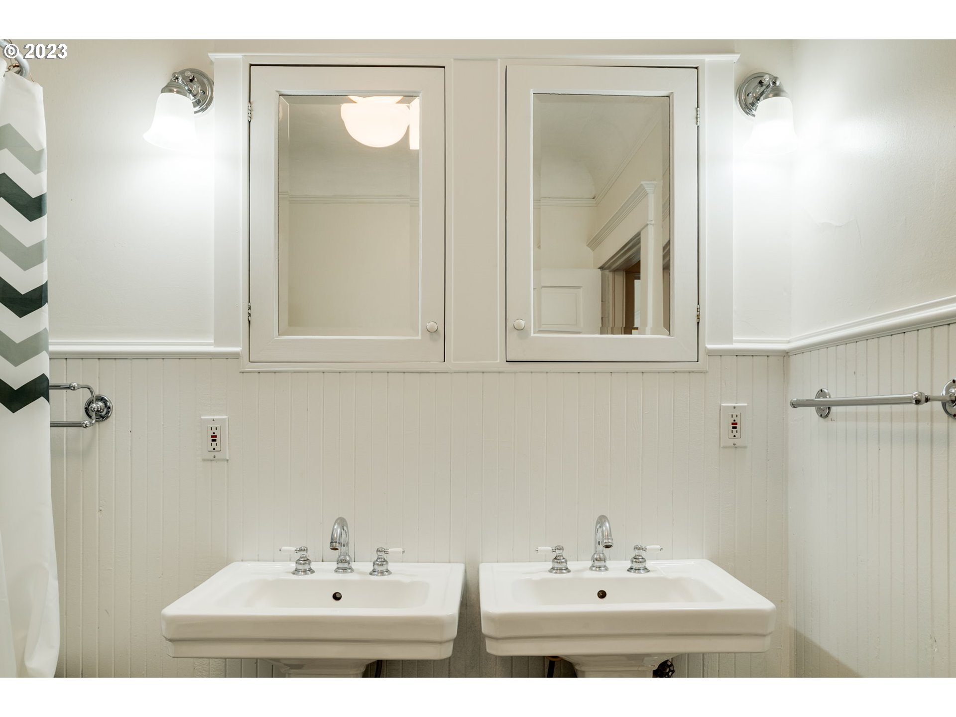 2129 Northwest Northrup Street, Unit 1 Portland, OR 97210 - Photo 29 of 37 a bathroom with a sink and a mirror