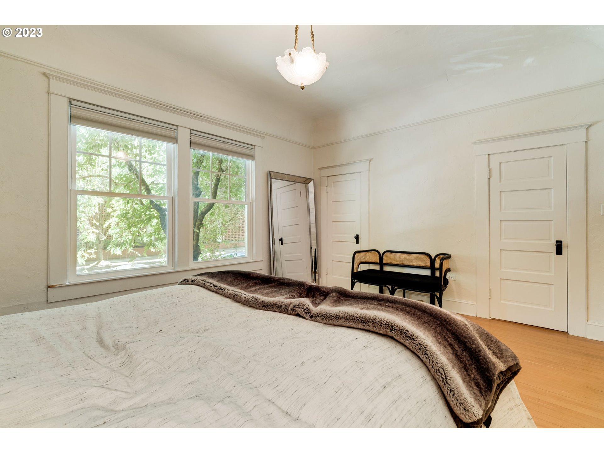 2129 Northwest Northrup Street, Unit 1 Portland, OR 97210 - Photo 35 of 37 a bedroom with a bed and a window