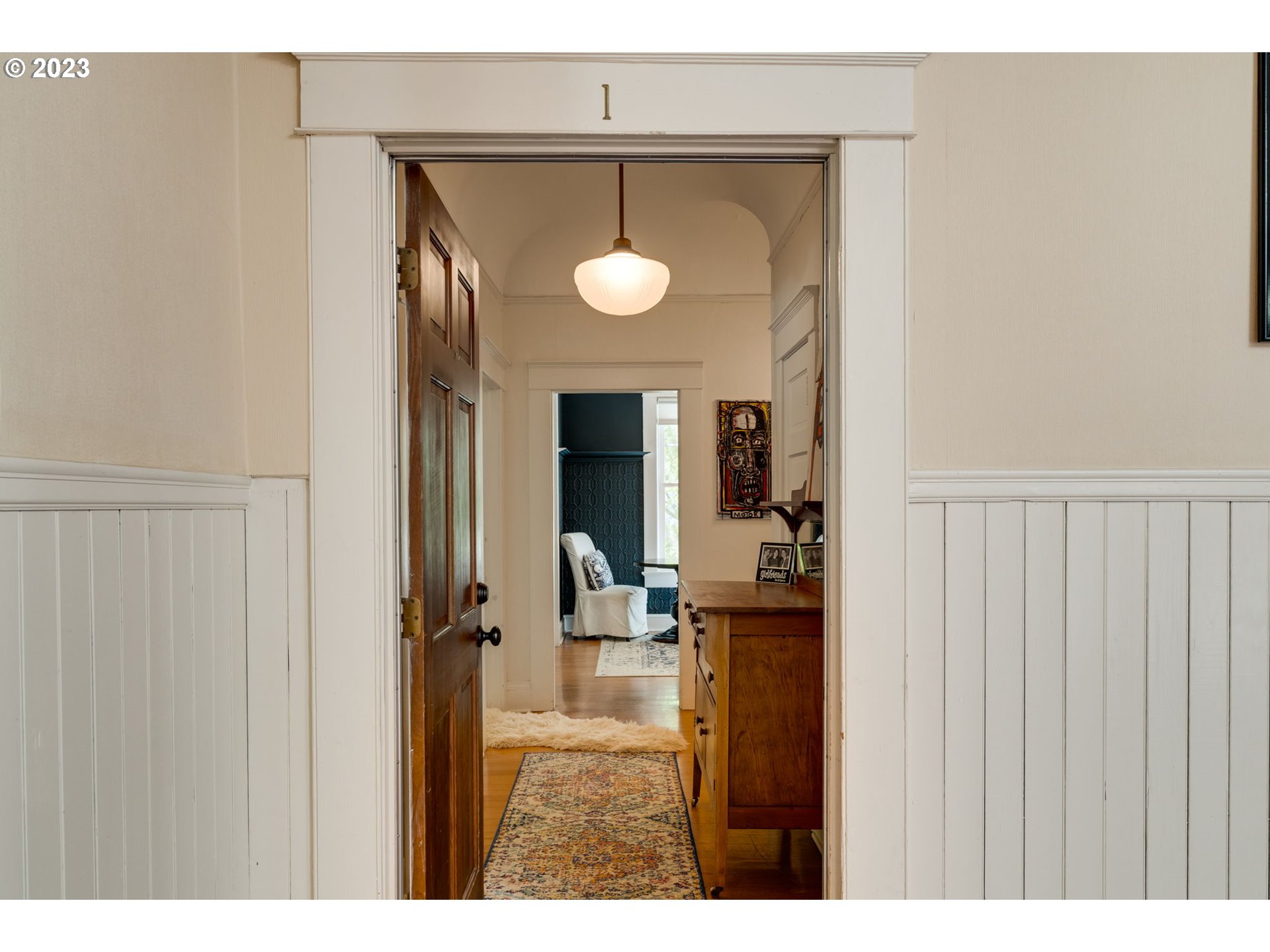 2129 Northwest Northrup Street, Unit 1 Portland, OR 97210 - Photo 6 of 37 a view of a kitchen from the hallway