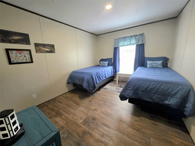 a bedroom with a bed and a night stand