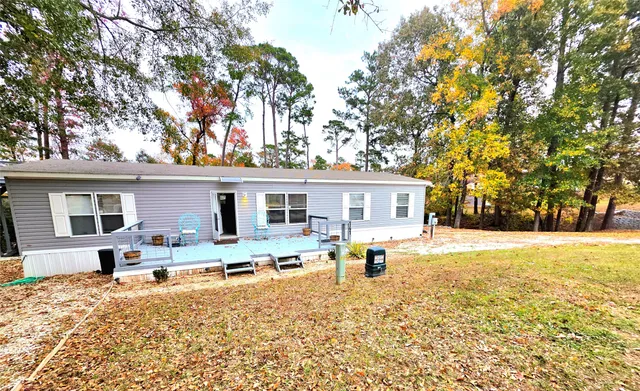 a house with trees in the background