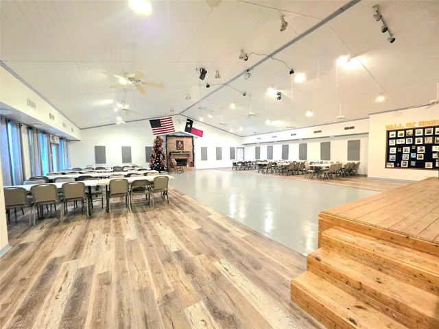 a living room with lots of furniture and a flat screen tv