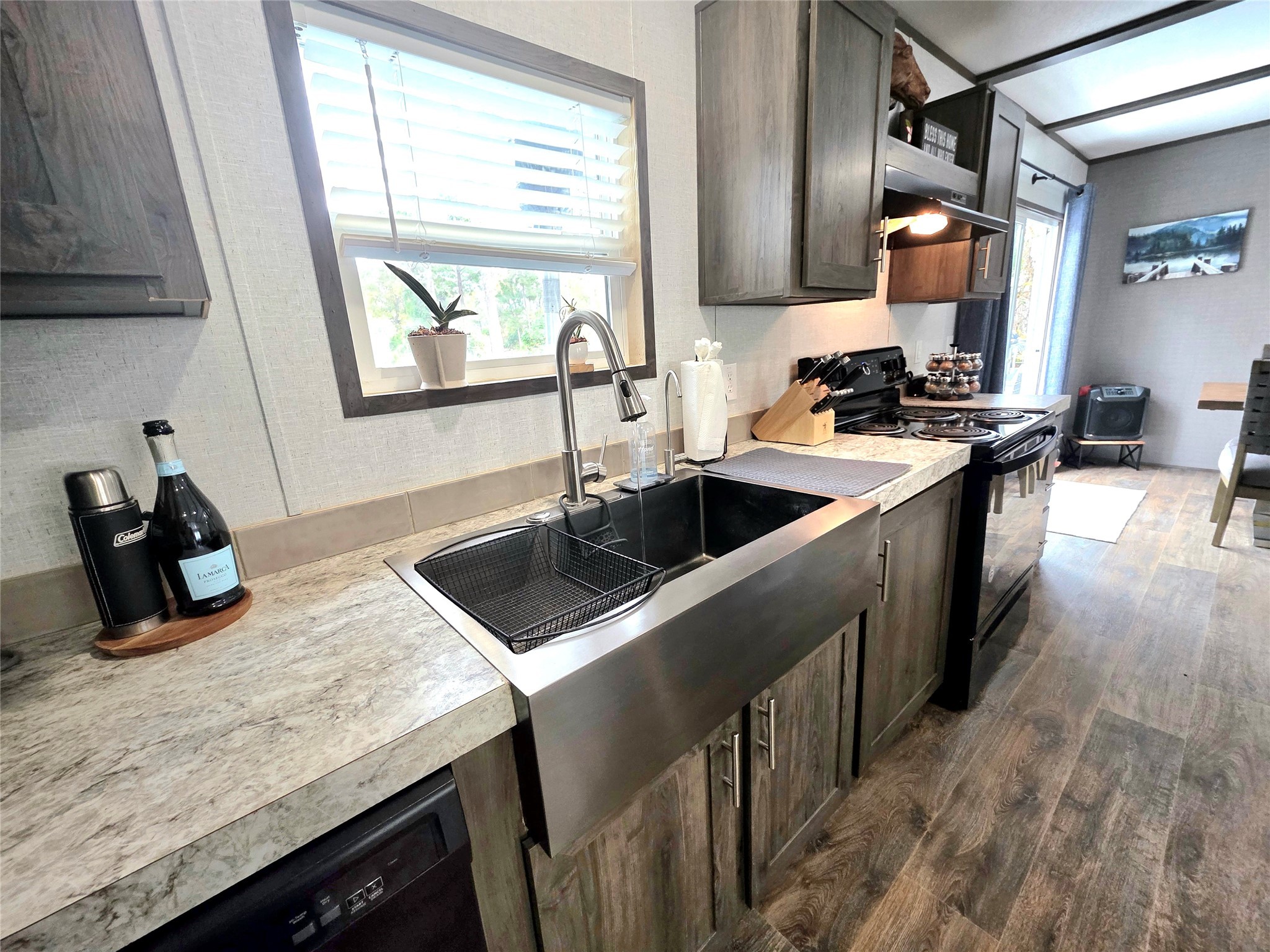 141 Canal Drive Point Blank, TX 77364 - Photo 5 of 28 a kitchen with a sink stove and cabinets