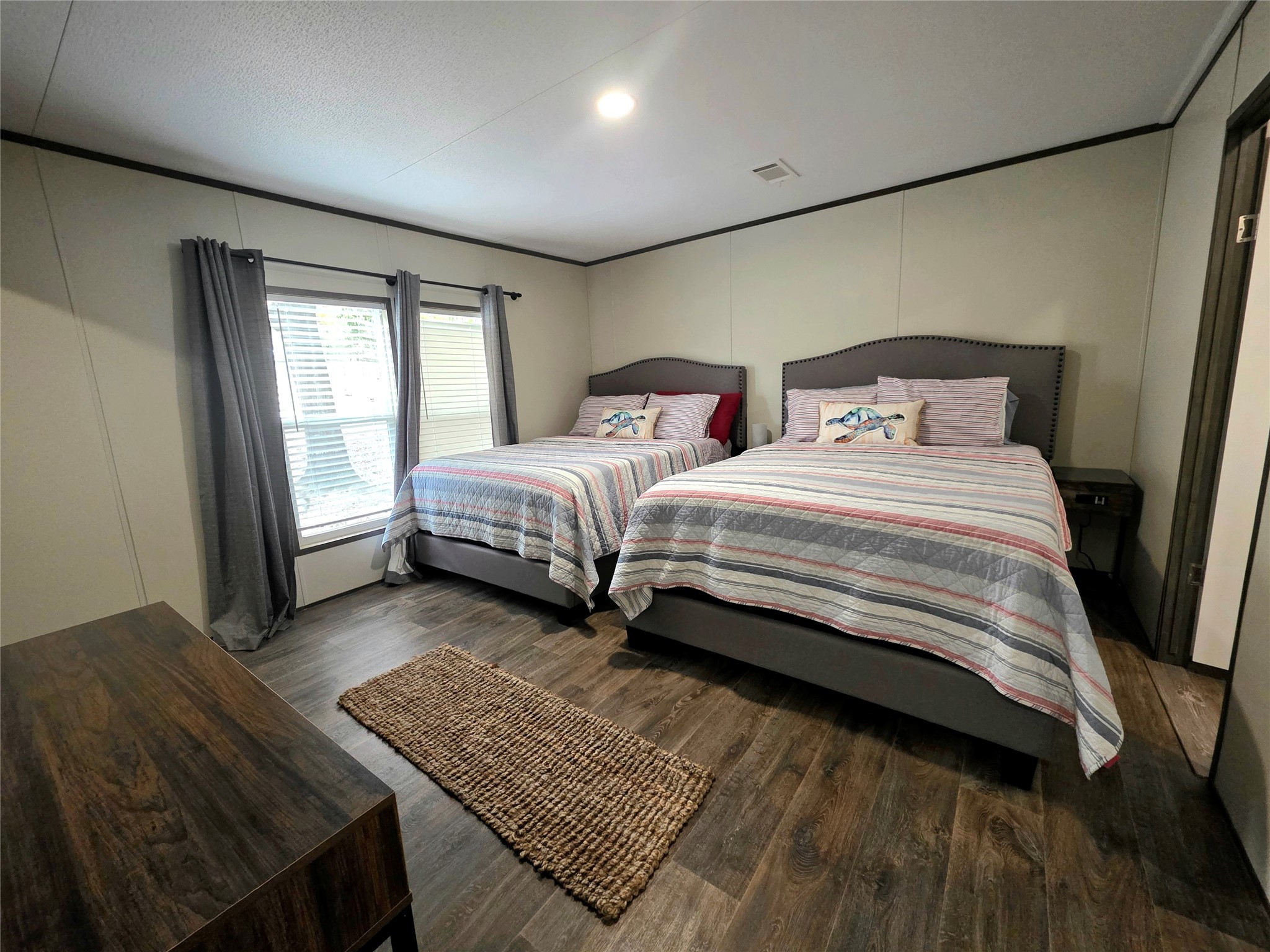 141 Canal Drive Point Blank, TX 77364 - Photo 8 of 28 a bedroom with two beds and a window