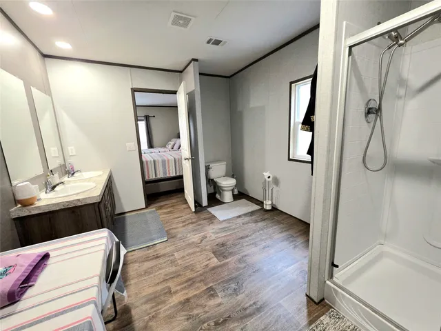 a bedroom with furniture and a window