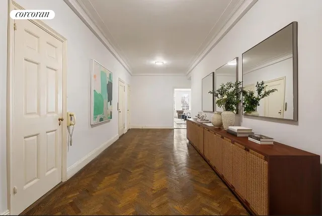 a spacious bedroom with a bed couch and a window