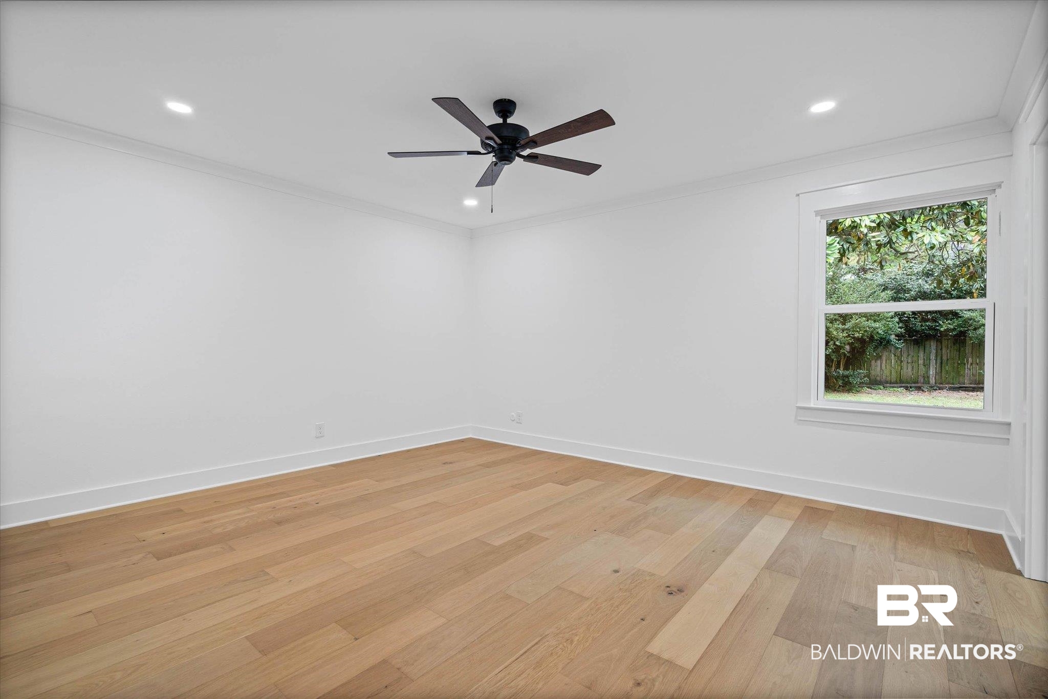 11 Schwaemmle Drive Mobile, AL 36608 - Photo 12 of 32 Unfurnished room featuring recessed lighting, light wood-style flooring, ornamental molding, and ceiling fan