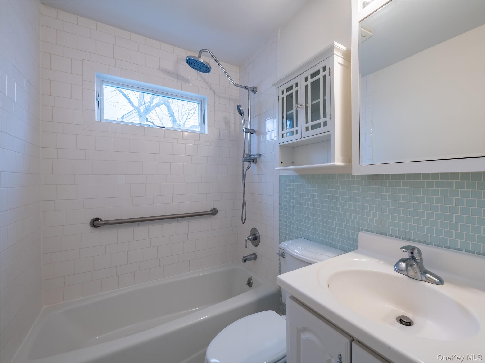 21 Marwood Road North Port Washington, NY 11050 - Photo 32 of 35 a bathroom with a sink toilet and bathtub