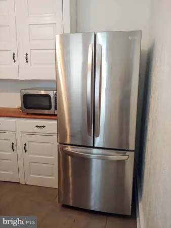a kitchen with granite countertop a sink and a stove