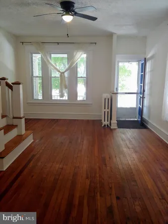 a kitchen with kitchen island cabinets and oven