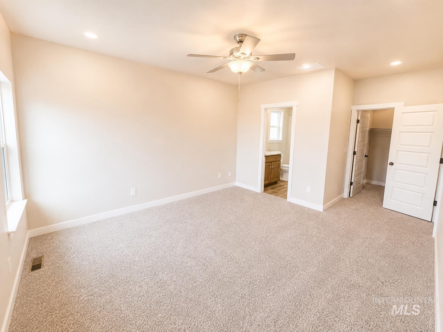 983 Quartz Road Kimberly, ID 83341 - Photo 10 of 18 Recessed lighting, ceiling fan with light fixture, light-toned carpeting, and white trim