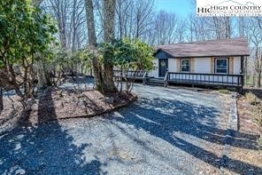 811 Pine Ridge Road Banner Elk, NC 28604 - Photo 2 of 35 a view of a house with a yard