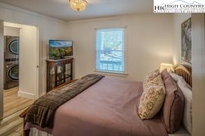 811 Pine Ridge Road Banner Elk, NC 28604 - Photo 21 of 35 a bedroom with a bed and a tv on table