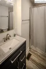 a bedroom with a bed and a tv on table