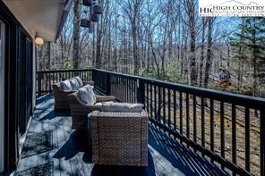 811 Pine Ridge Road Banner Elk, NC 28604 - Photo 26 of 35 a balcony with wooden floor