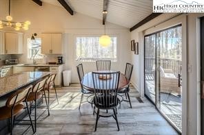 811 Pine Ridge Road Banner Elk, NC 28604 - Photo 6 of 35 a view of a dining room with furniture window and wooden floor