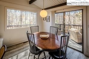 811 Pine Ridge Road Banner Elk, NC 28604 - Photo 8 of 35 a view of a dining room with furniture window and wooden floor