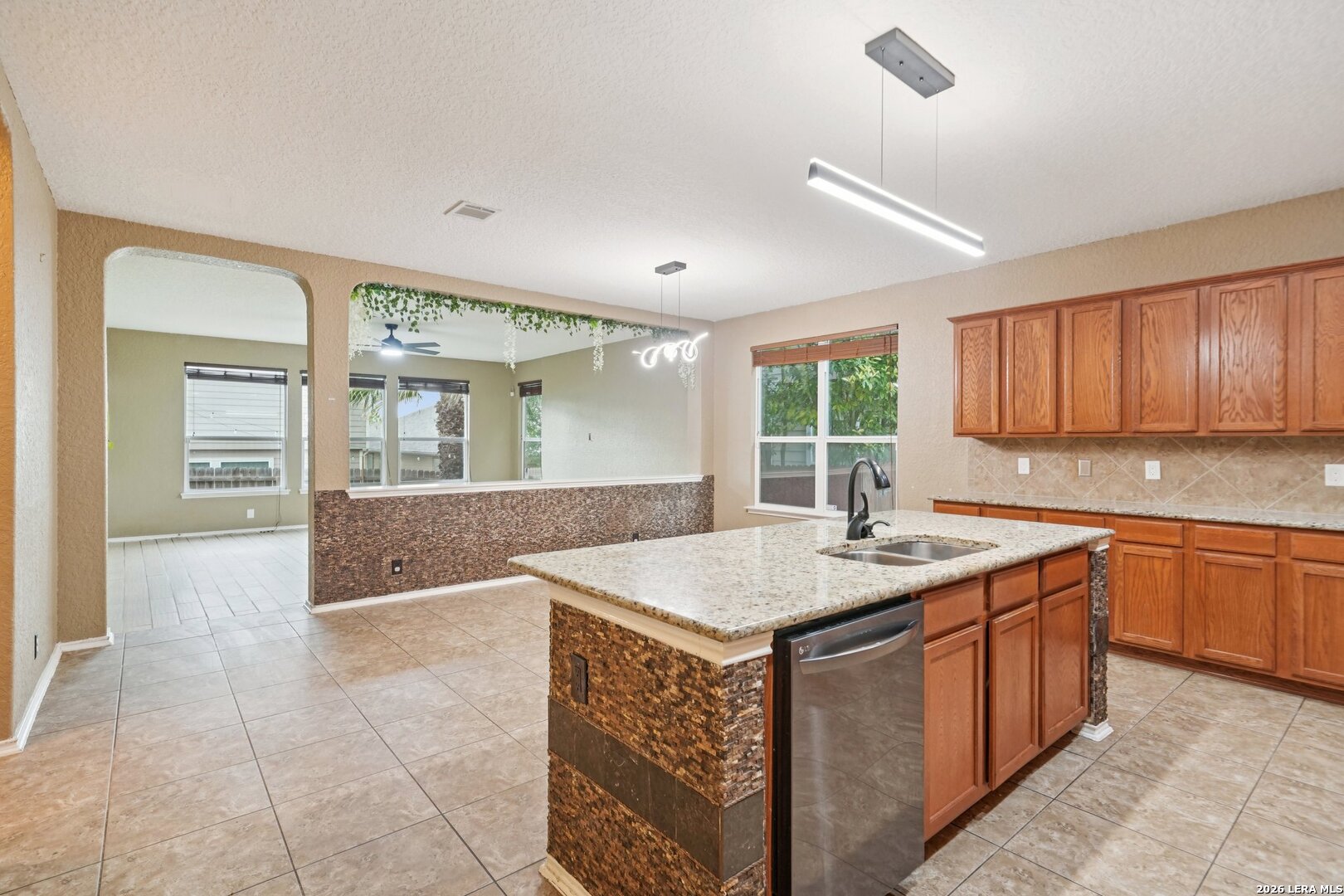 9536 Gold Stage Road San Antonio, TX 78254 - Photo 13 of 39 a kitchen with a sink stove and cabinets