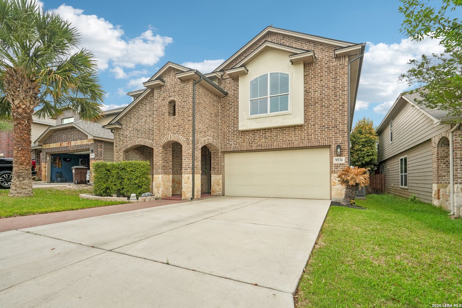9536 Gold Stage Road San Antonio, TX 78254 - Photo 2 of 39 a front view of a house with a yard and garage